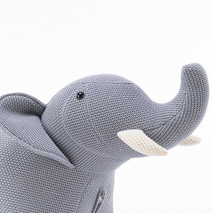 Contemporary mixed weave fabric ottoman decoration elephant in panoramic view.