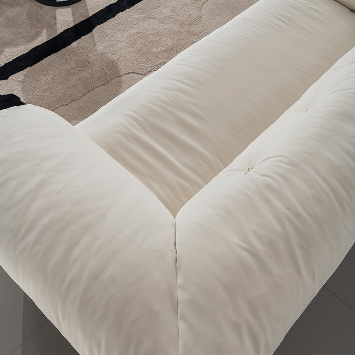 Cream suede fabric 3 seater sofa camellia in panoramic view.