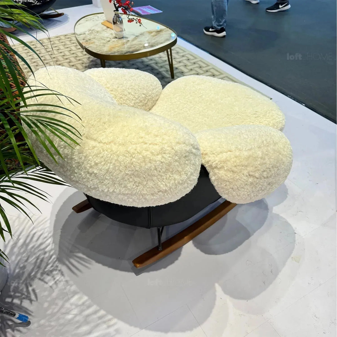 Cream teddy fabric rocking 1 seater sofa swank in real life style.