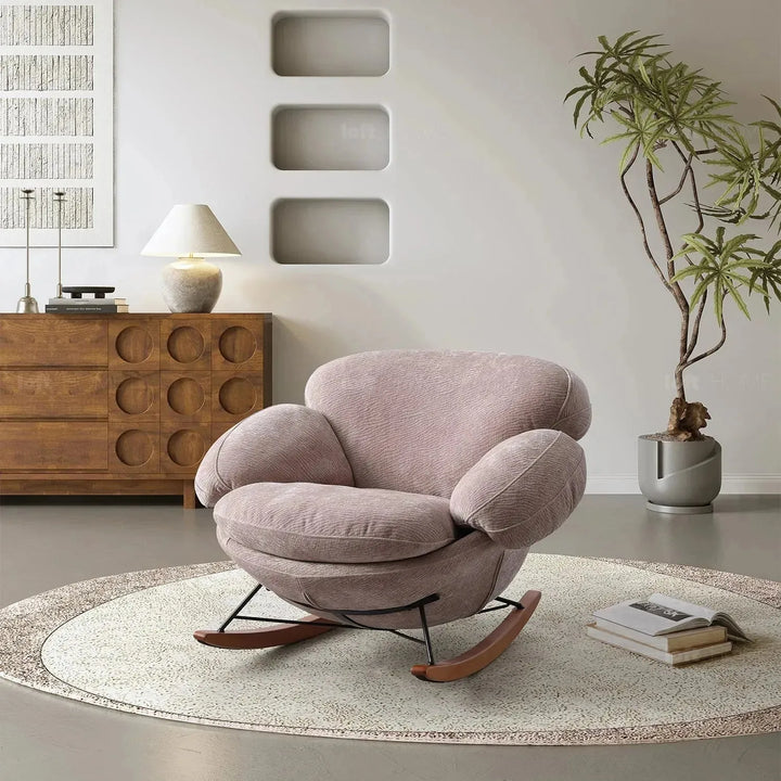 Cream teddy fabric rocking 1 seater sofa swank in details.