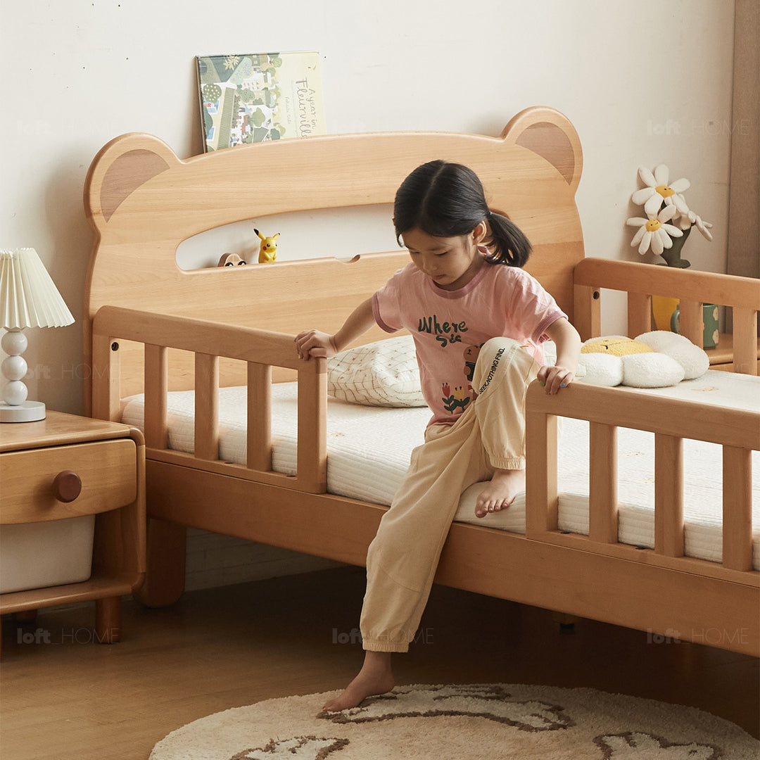 Scandinavian beech wood safety rails kids bed hugsy in close up details.