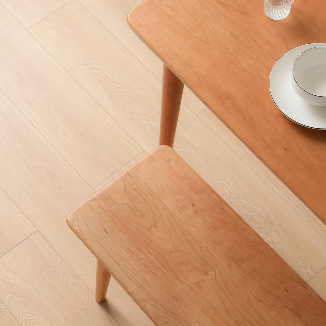 Scandinavian cherry wood dining bench green material variants.