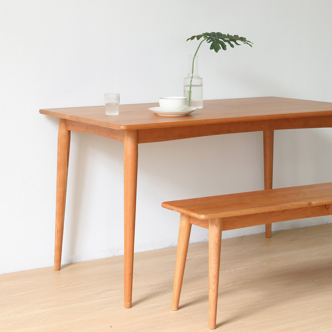 Scandinavian cherry wood dining bench green in details.