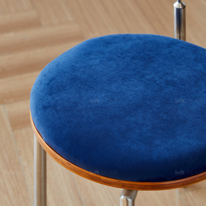 Scandinavian cherry wood mix weave fabric dining chair timeless in close up details.