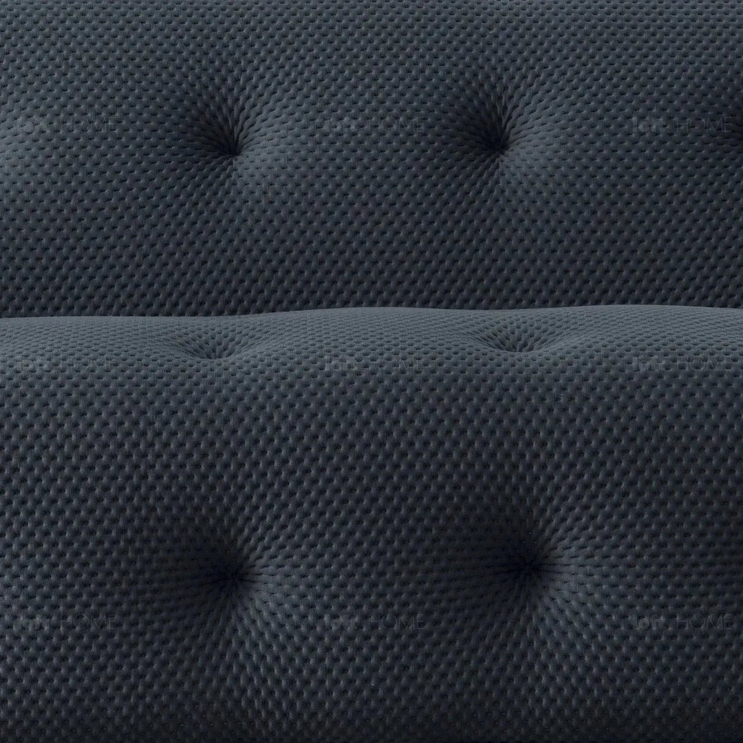 Contemporary fabric 2 seater sofa blogger in close up details.
