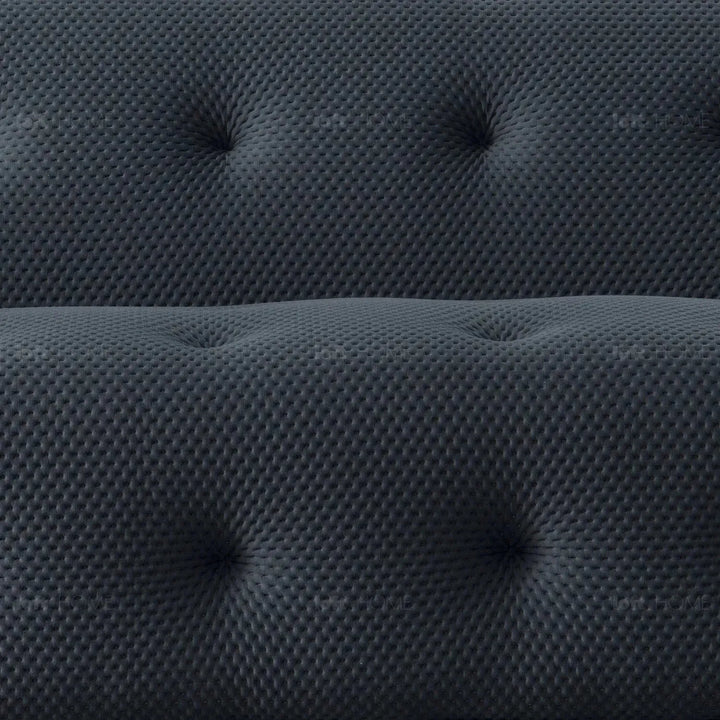 Contemporary fabric 2 seater sofa blogger in close up details.