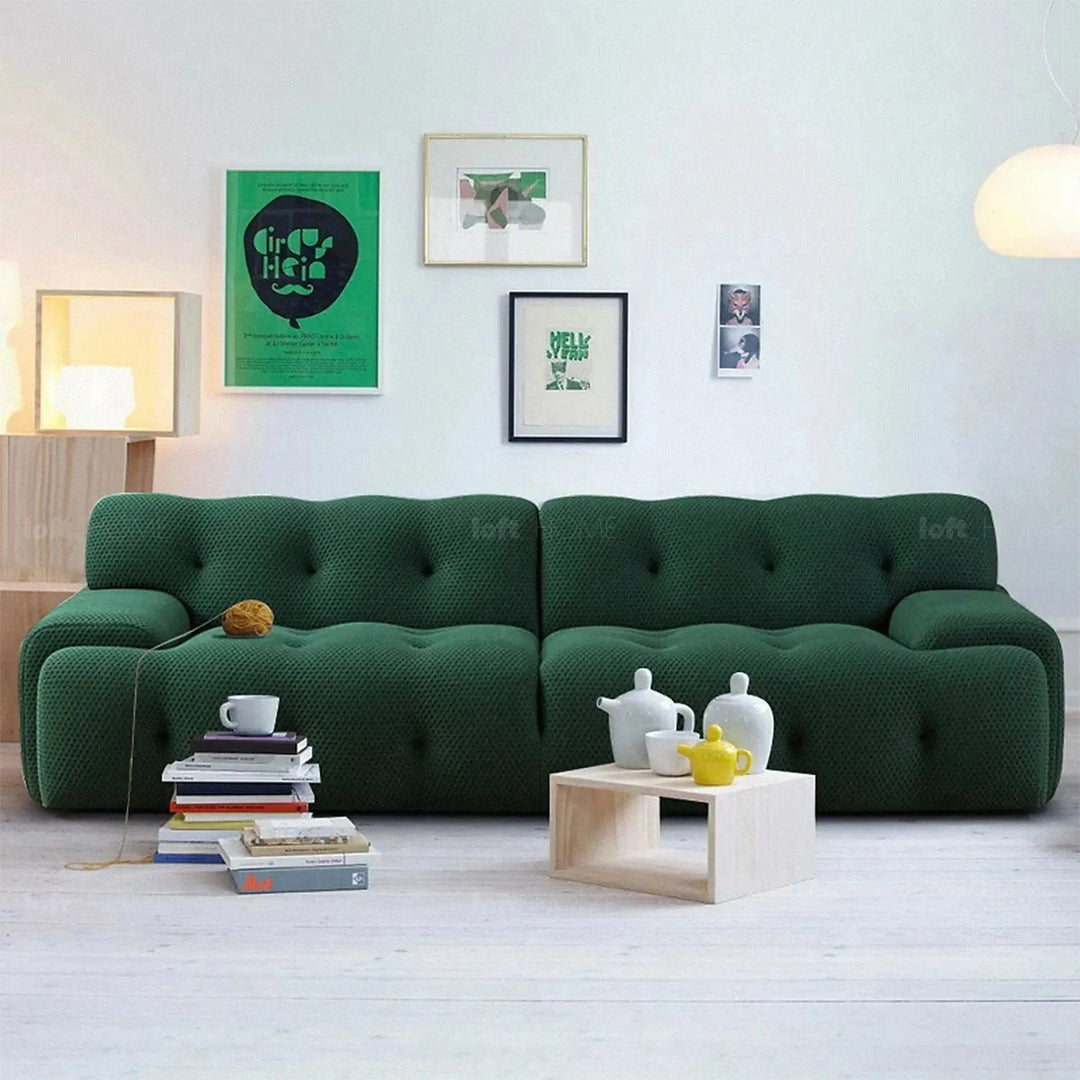 Contemporary fabric 4 seater sofa blogger in close up details.