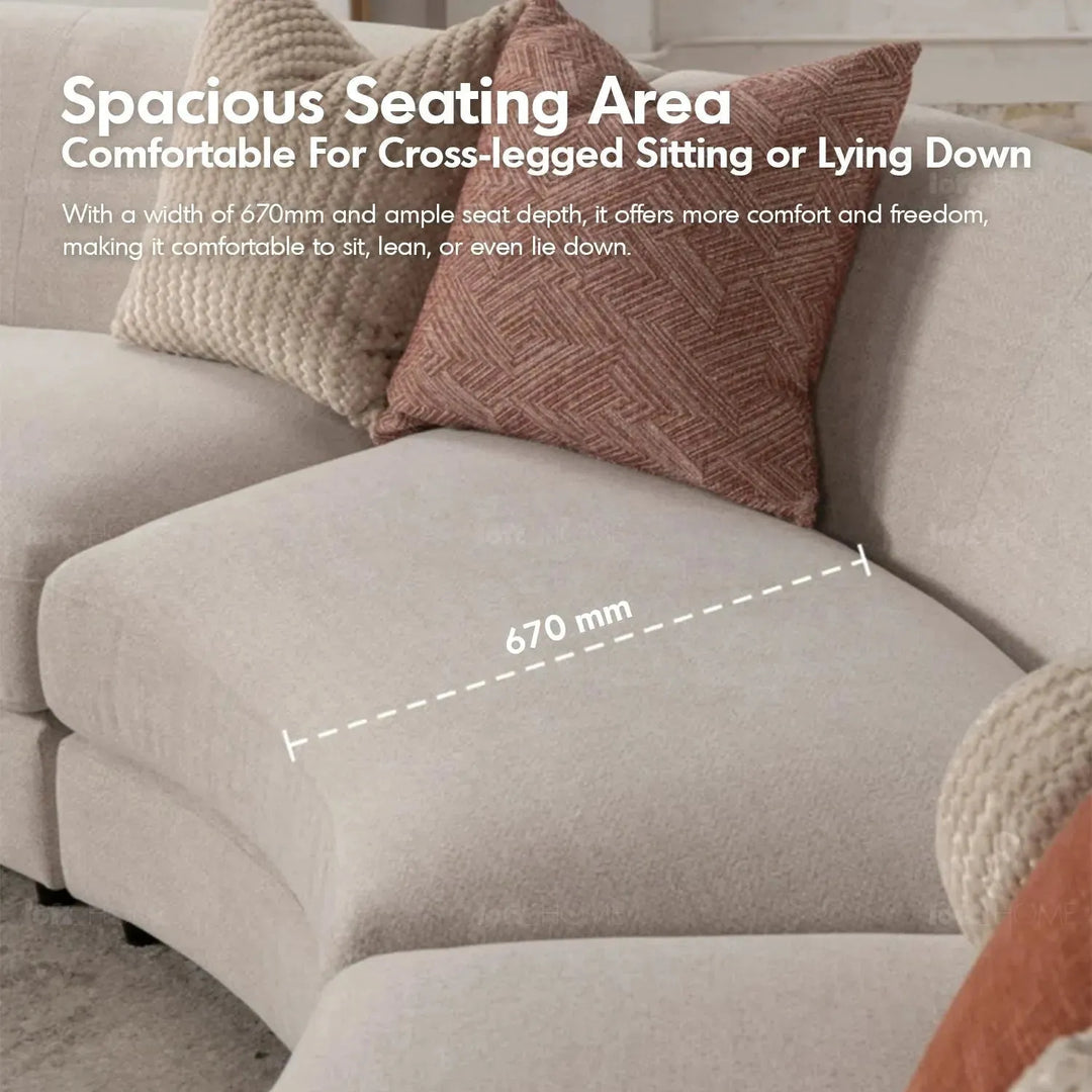 Cream fabric modular 4 seater sofa groove with context.