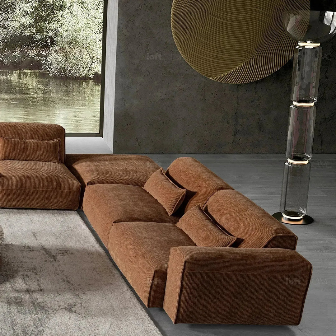 Modern corduroy velvet fabric modular 4 seater sofa opera in still life.