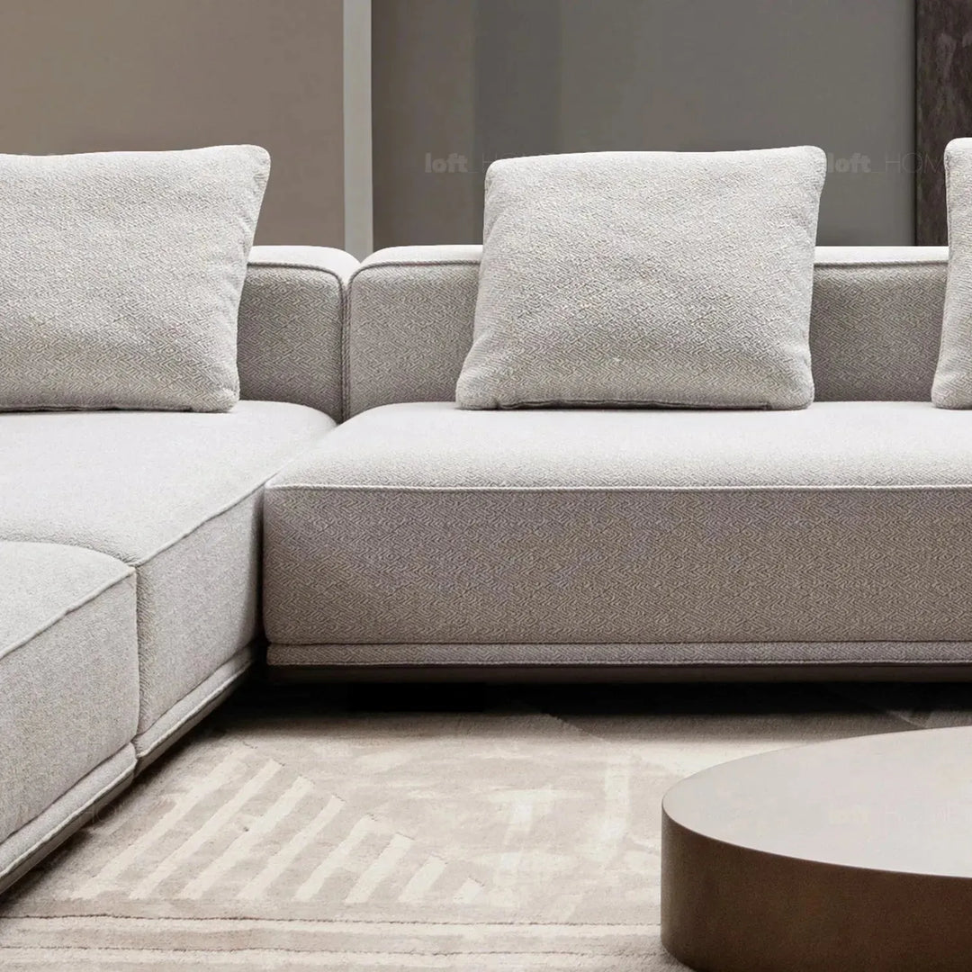 Minimalist mixed weave fabric modular ottoman eleganza l with context.