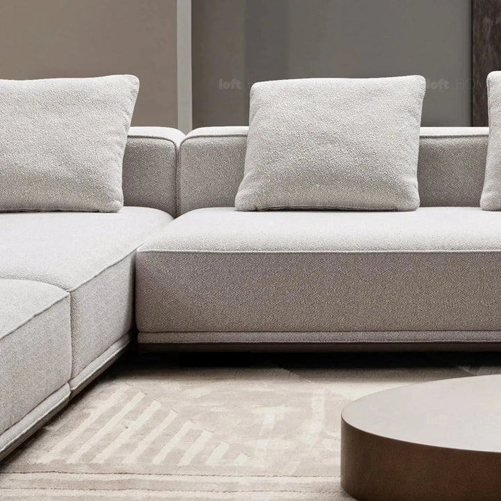 Minimalist mixed weave fabric modular ottoman eleganza l with context.