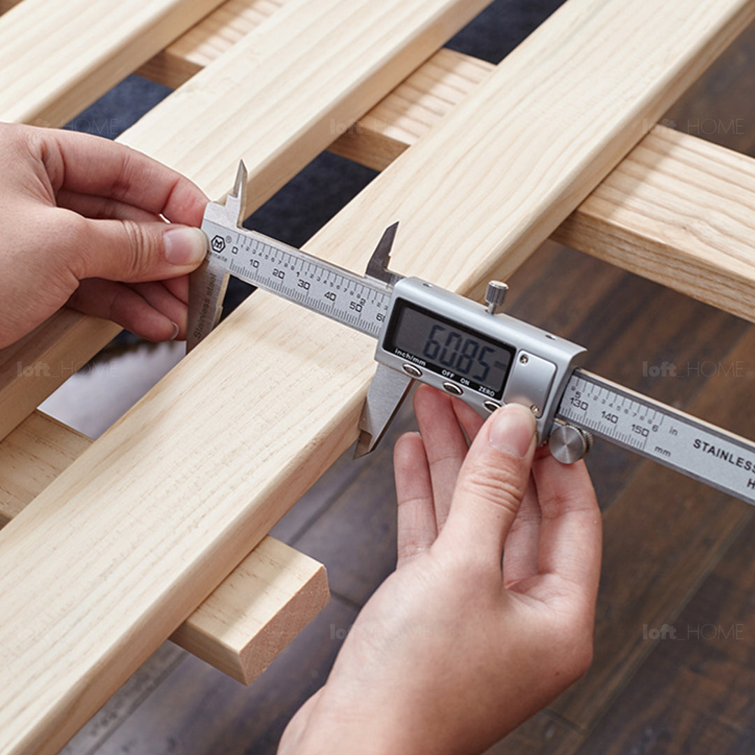 Scandinavian oak wood floating bed glide in close up details.