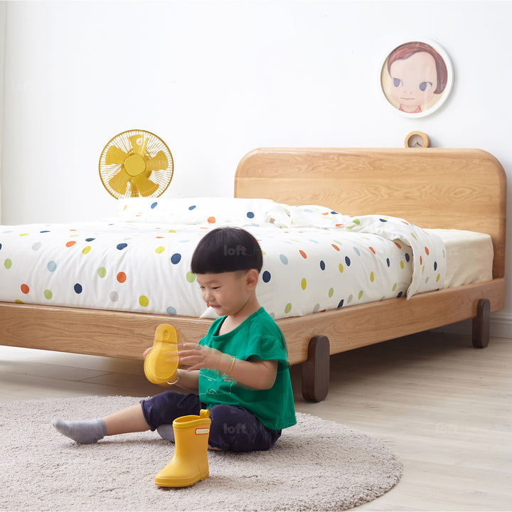 Scandinavian oak wood kids bed peblo with context.