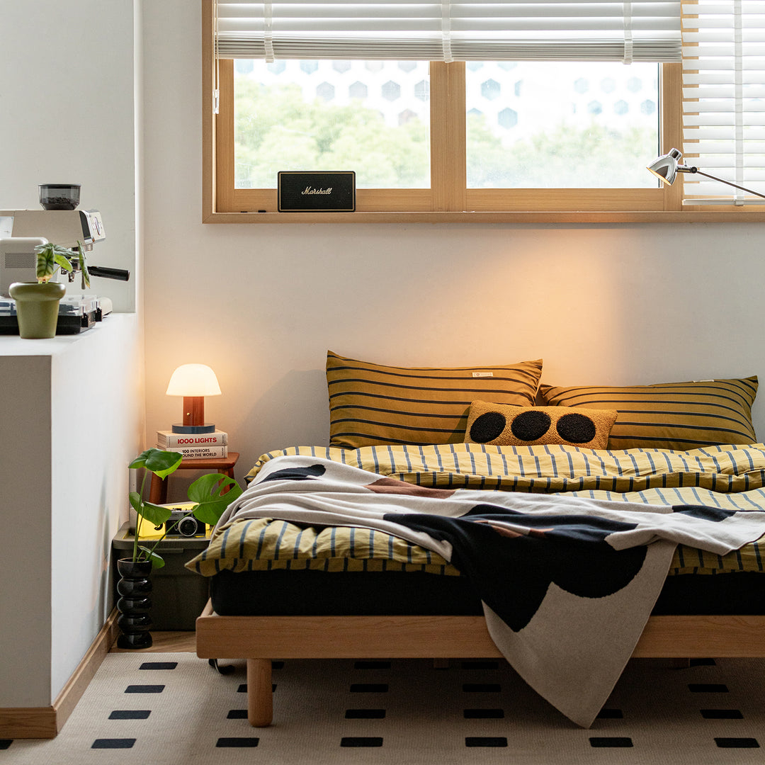 Scandinavian cherry wood platform bed isle in real life style.