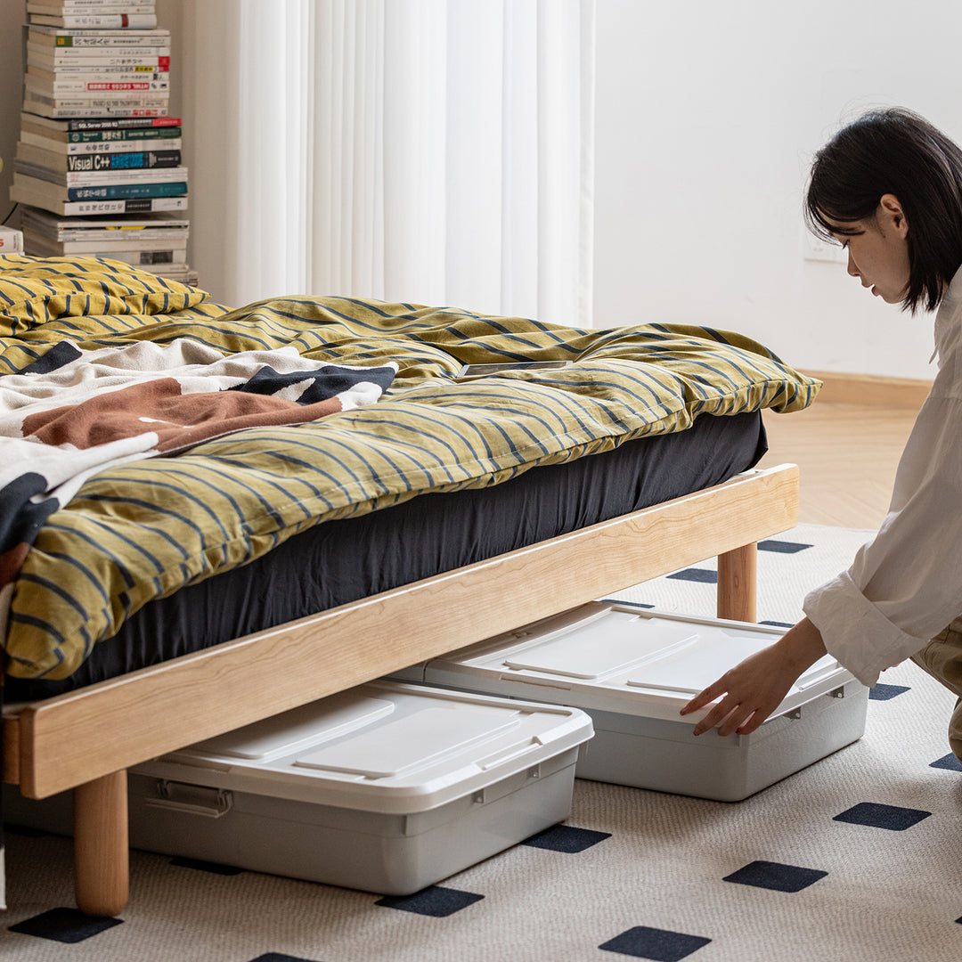 Scandinavian cherry wood platform bed isle with context.