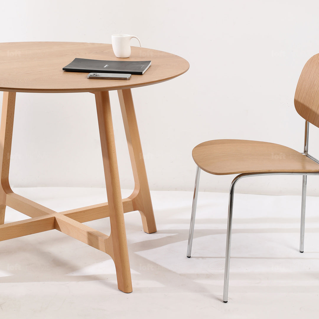 Scandinavian oak wood veneer round dining table orbit with context.