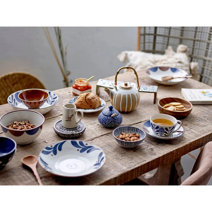 Carved stone biscuit mould with whitewashed finish decor color swatches.