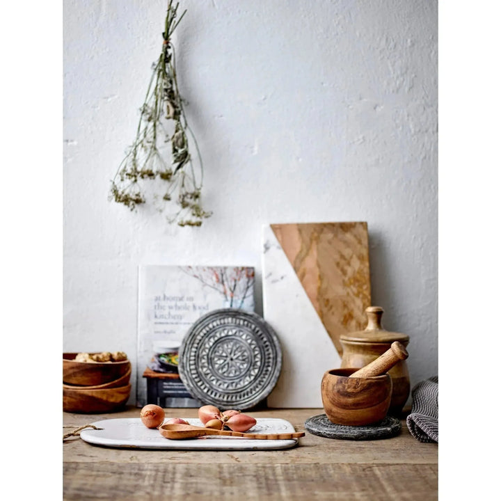Carved stone biscuit mould with whitewashed finish decor material variants.