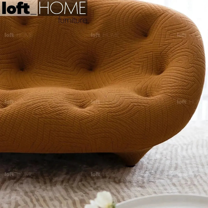 Contemporary fabric 1 seater sofa conch appa in panoramic view.