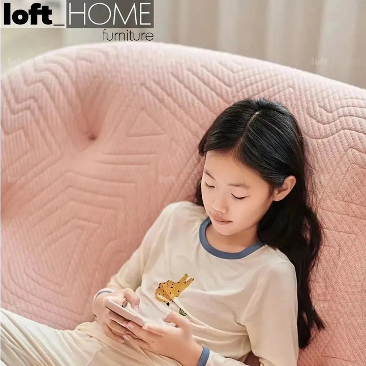 Contemporary fabric 1 seater sofa conch appa in still life.