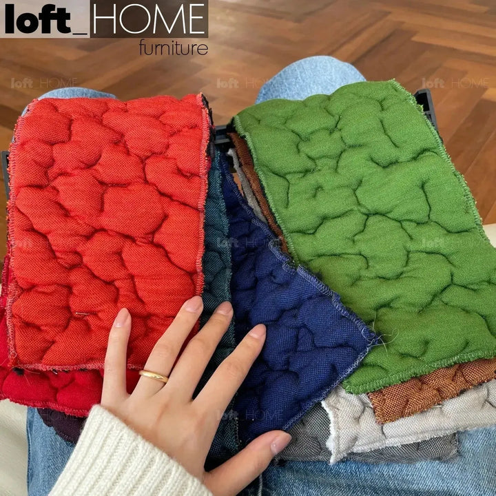 Contemporary fabric 1 seater sofa conch moby material variants.