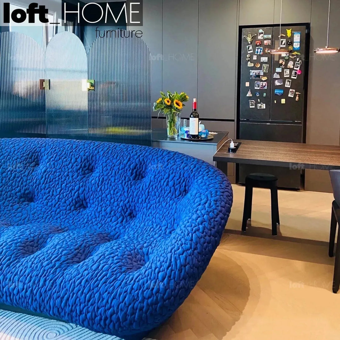 Contemporary fabric 1 seater sofa conch moby in still life.