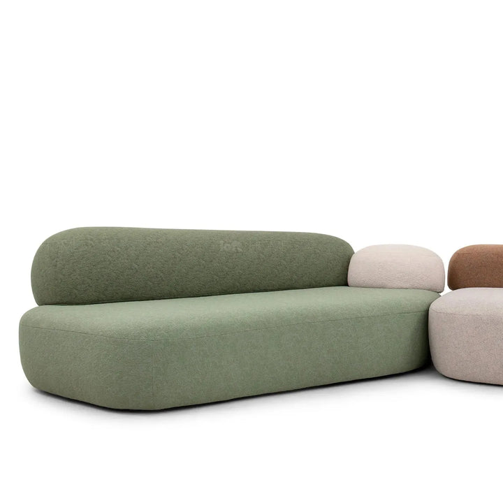 Contemporary fabric 3 seater sofa pebble chaise in still life.