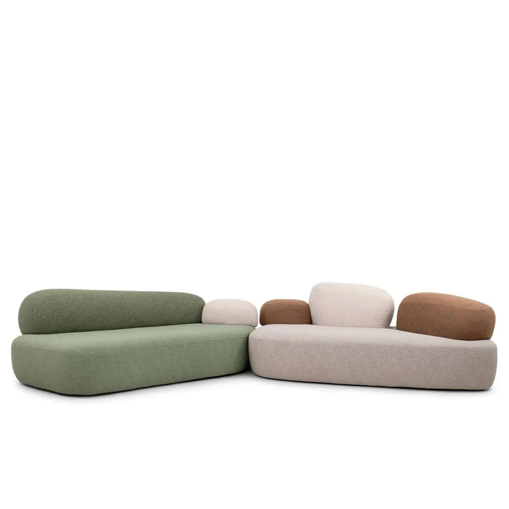 Contemporary fabric 3 seater sofa pebble chaise in panoramic view.