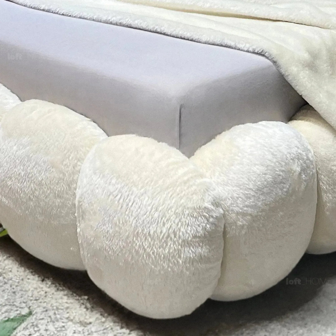 Cream fabric bed pannacotta in close up details.