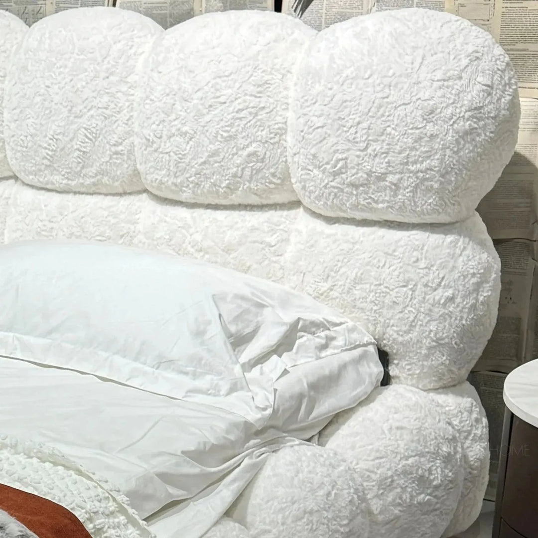 Cream fabric bed pannacotta with context.