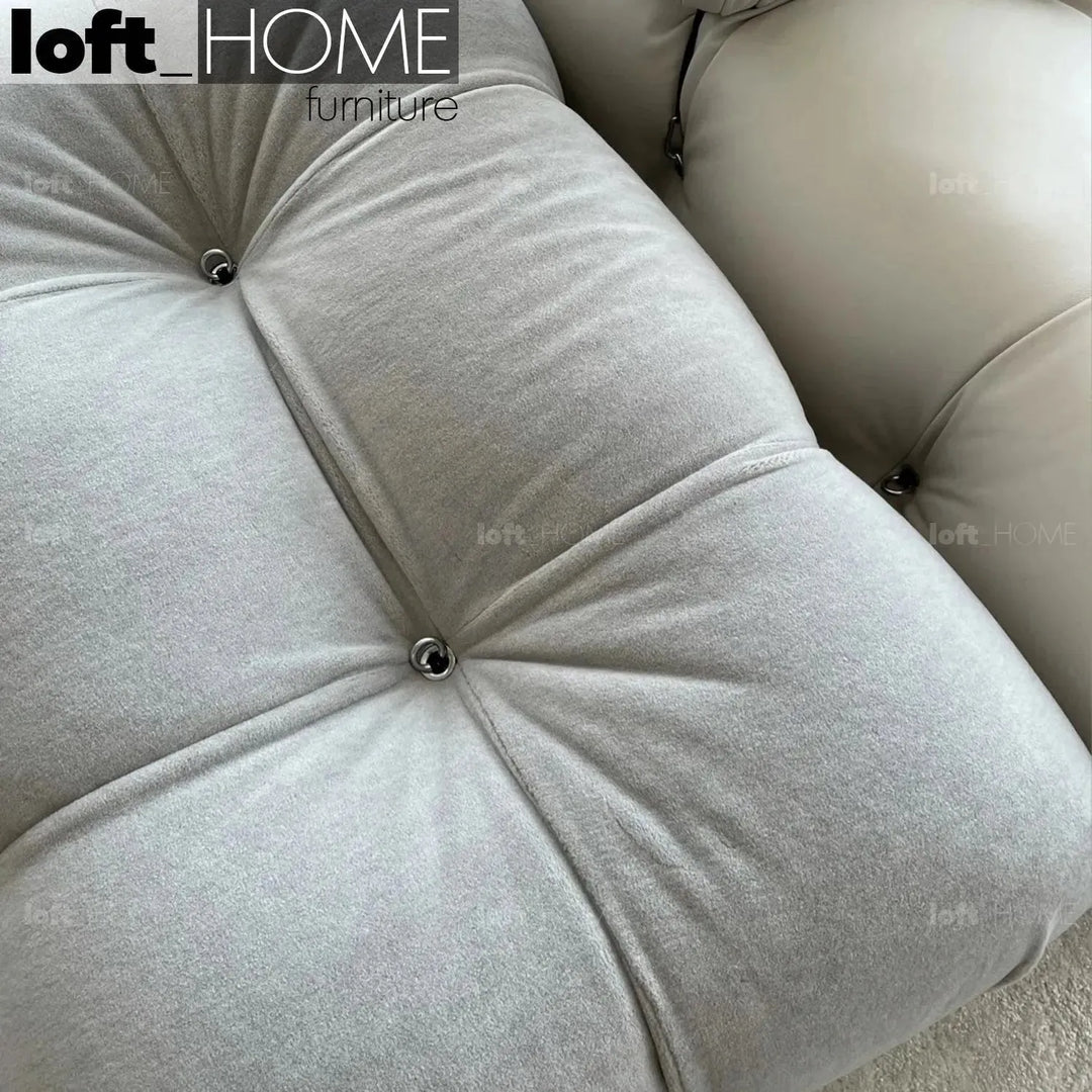 Contemporary fabric ottoman camaleonda in still life.