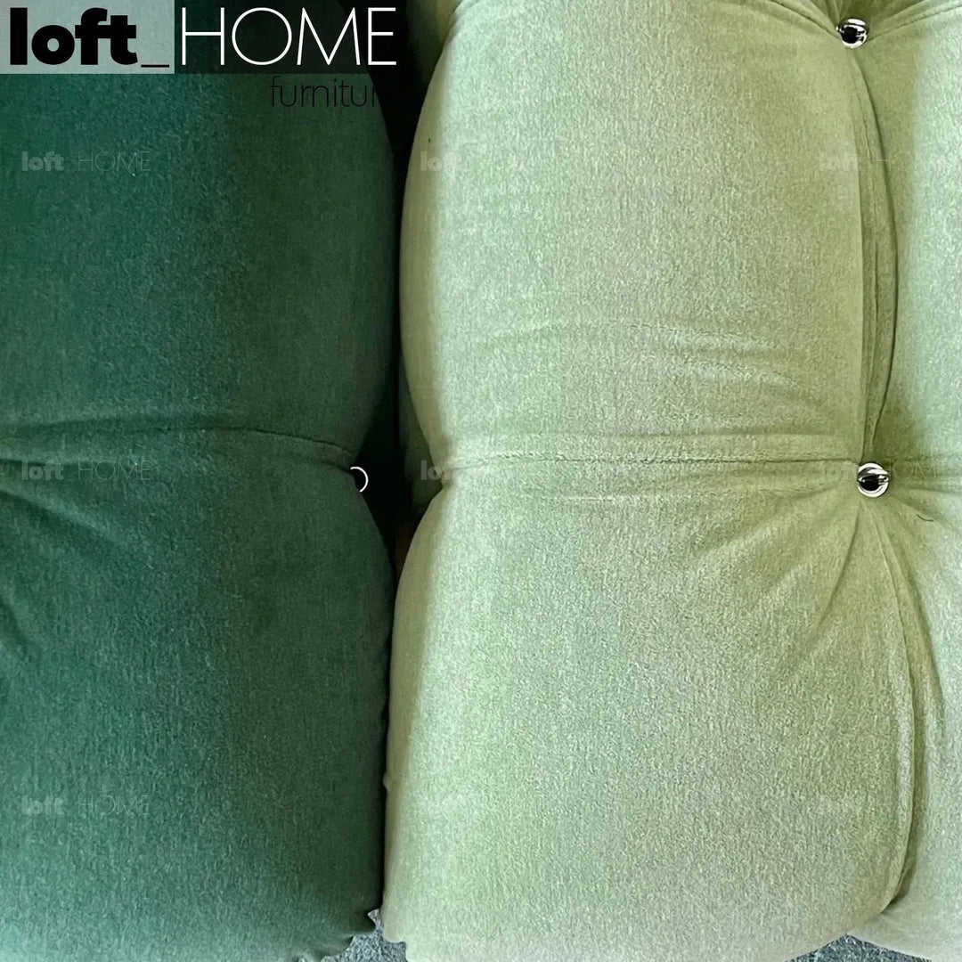 Contemporary fabric ottoman camaleonda in panoramic view.