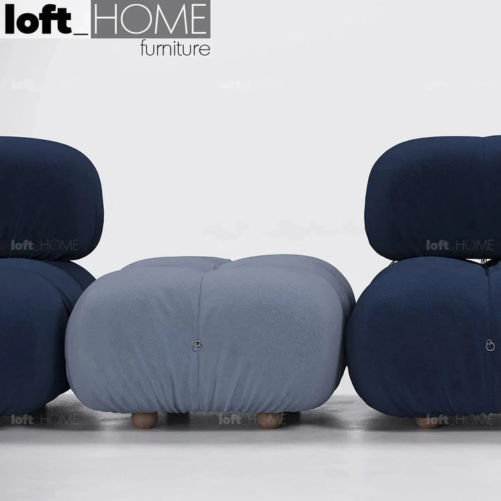 Contemporary fabric ottoman camaleonda in details.