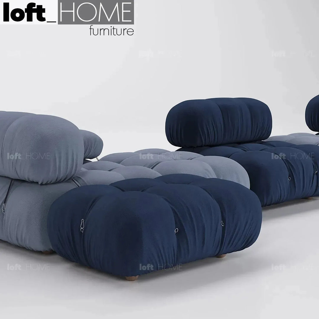 Contemporary fabric ottoman camaleonda with context.