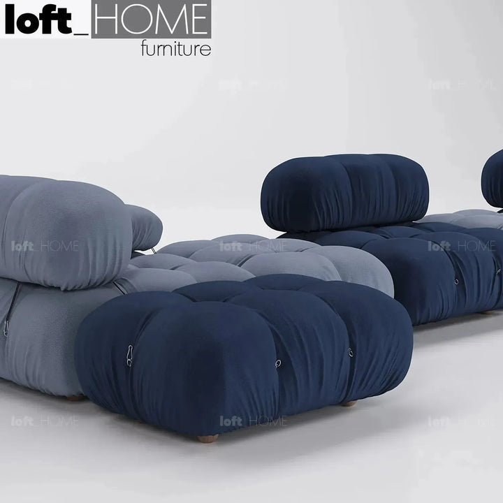 Contemporary fabric ottoman camaleonda with context.