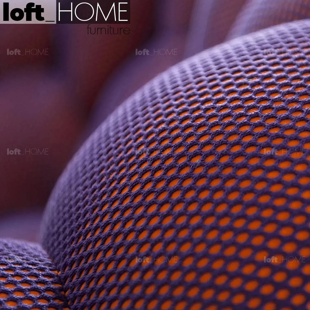 Contemporary fabric round ottoman bubble with context.