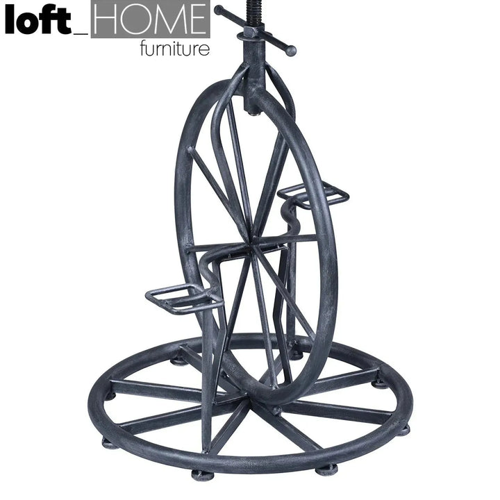 Industrial wood height adjustable bar stool bike in real life style.