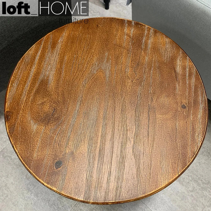 Industrial wood side table height adjustable in real life style.