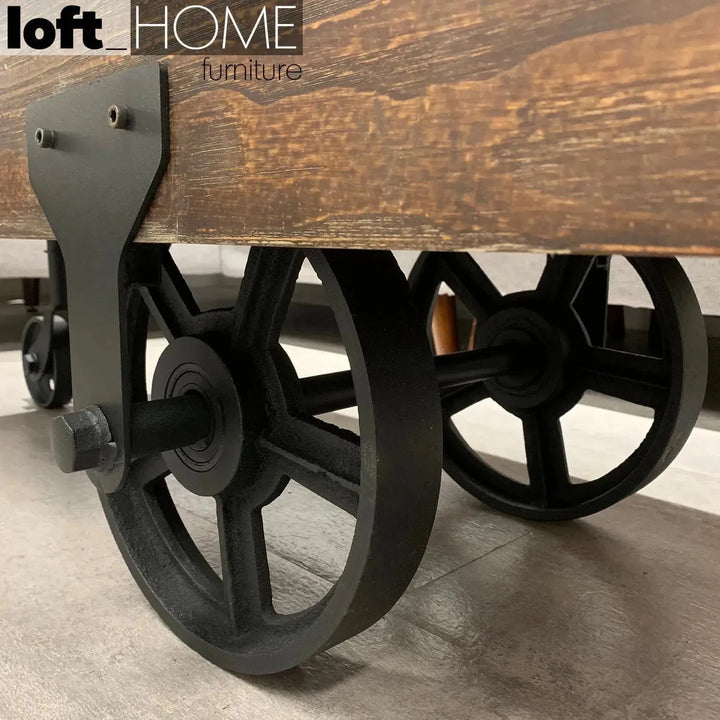 Industrial wood wheel coffee table industrial in panoramic view.