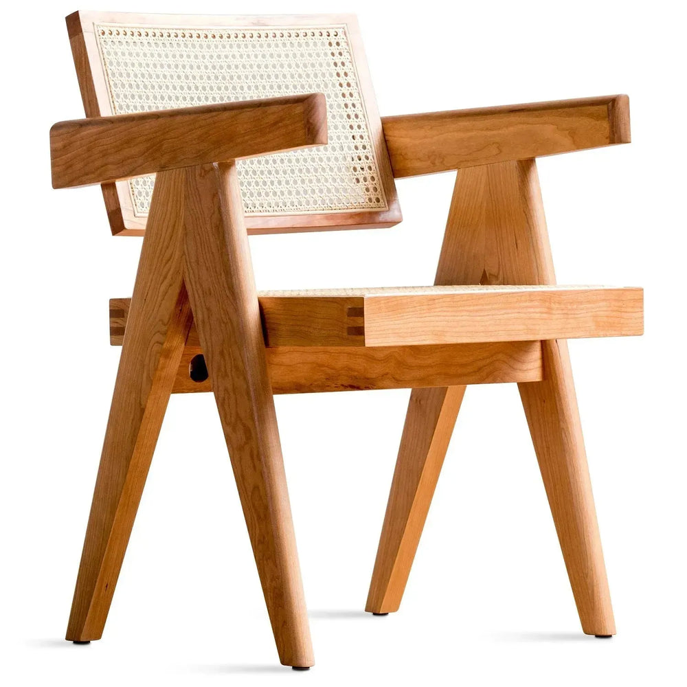 Scandinavian rattan armrest dining chair jeanneret in white background.