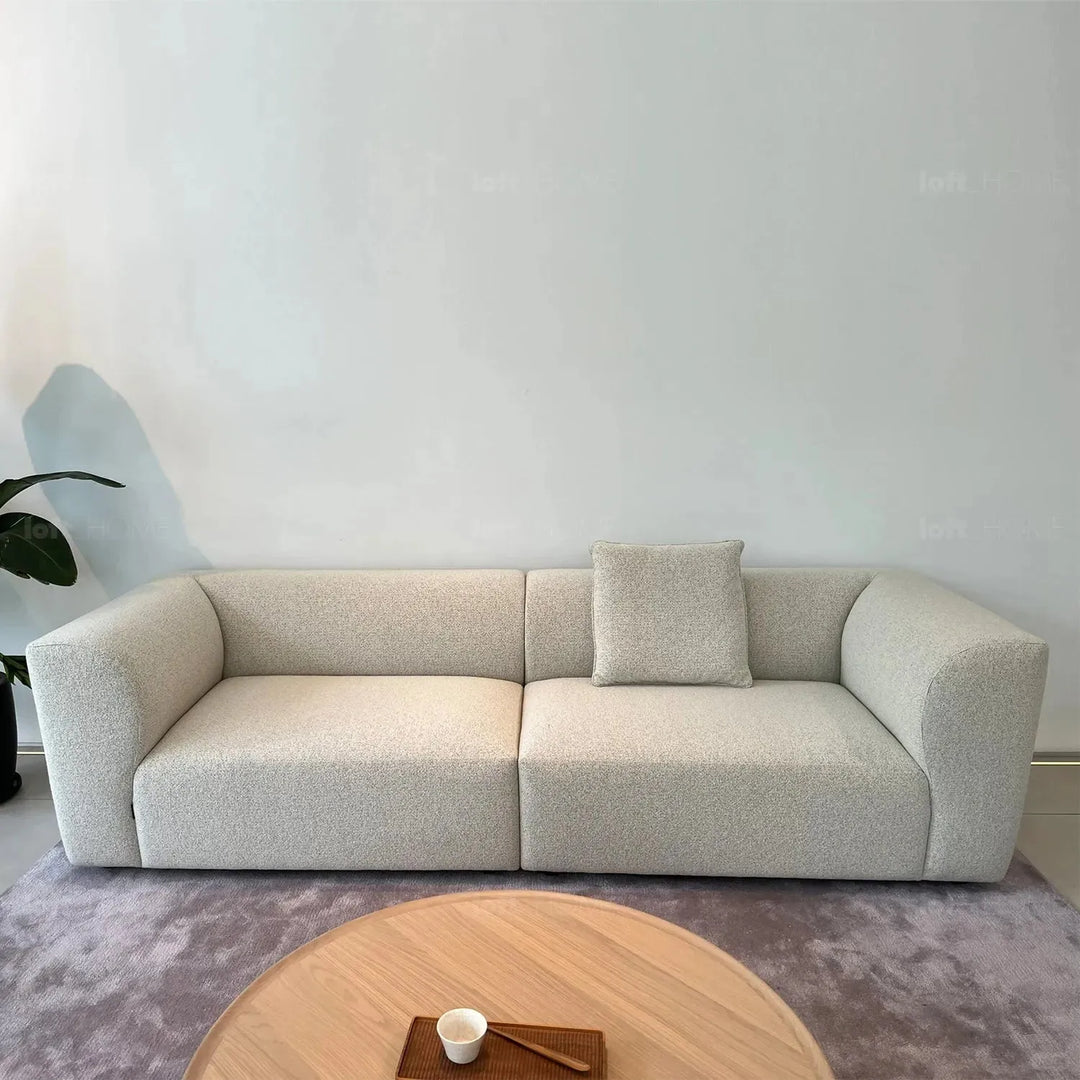 Minimalist fabric 3 seater sofa flower in panoramic view.