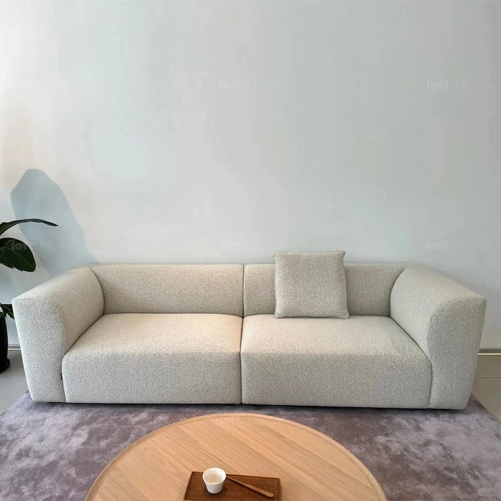 Minimalist fabric 3 seater sofa flower in panoramic view.
