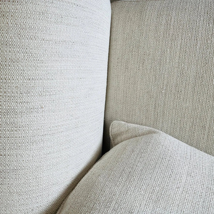 Minimalist fabric 3 seater sofa flower in still life.