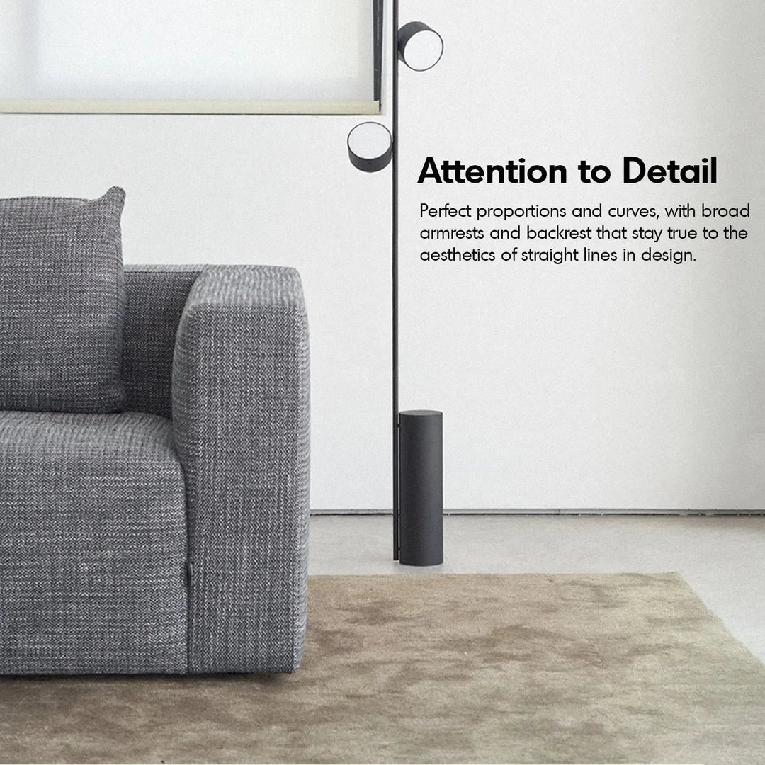 Minimalist fabric 3.5 seater sofa bri with context.