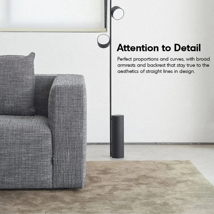 Minimalist fabric 3.5 seater sofa bri with context.