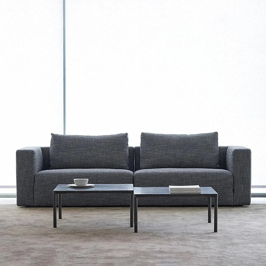 Minimalist fabric 3.5 seater sofa bri in close up details.