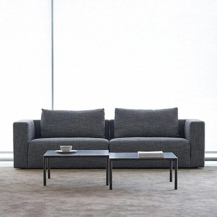 Minimalist fabric 3.5 seater sofa bri in close up details.