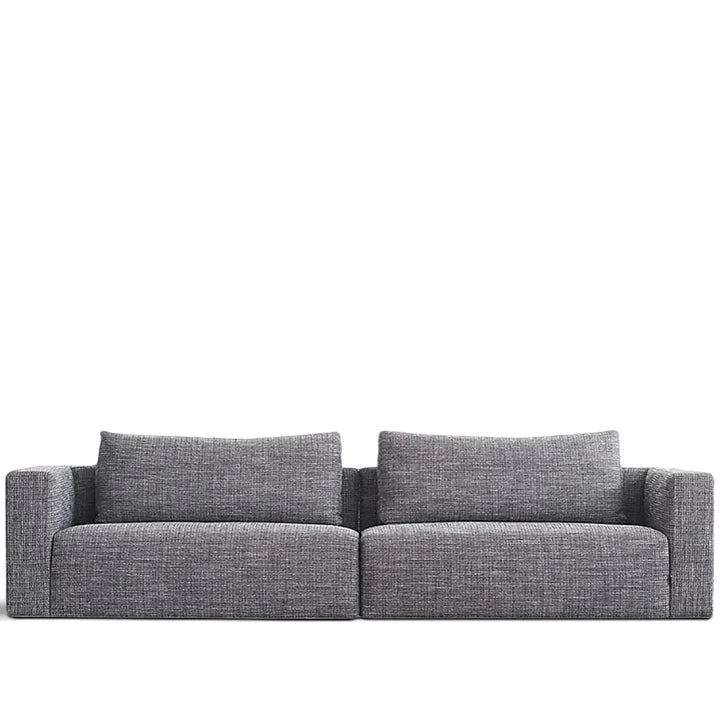 Minimalist fabric 4 seater sofa bri in white background.