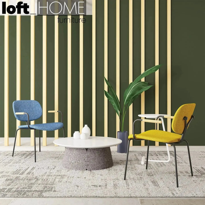 Industrial fabric dining chair et arm with context.