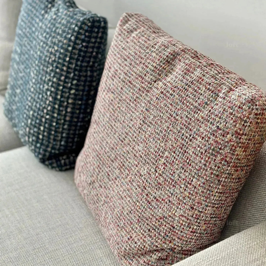 Modern fabric sofa pillow autumn pink in real life style.